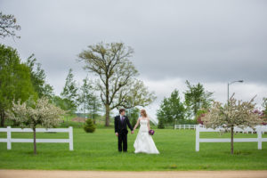 Bride and groom walking in the garden