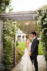 Bride and groom holding each other and posing