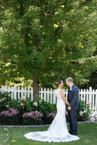 Bride and groom holding each other