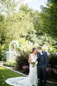 Bride and groom holding each other and posing