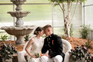 Bride and groom posing holding each other