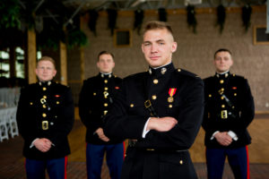 Group of men in same outfit on display