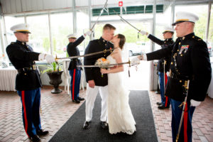 Bride and groom kissing between other men