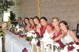 Group of women in red outfit on display