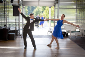 Couple in black and blue outfit dancing