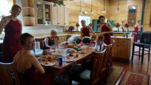 Group of women having food at the dining table