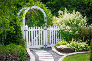 Close view of white gate in the garden