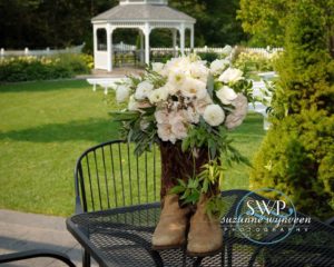 Boots with flowers on the table