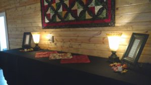 Table with two lights, cloths and photo frames