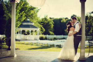 Bride and groom kissing each other