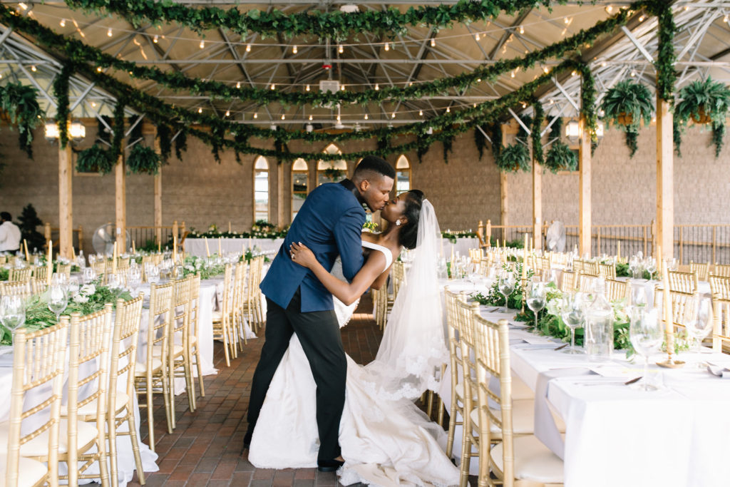 Bride and groom kissing each other