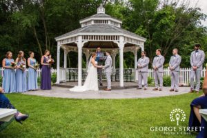 wedding party under garden gazebo