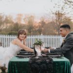 Bride and groom holding each other hands