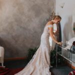 Bride in white wedding gown on display