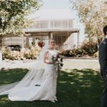 Bride walking holding flower bouquet