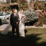 Bride holding her father walking