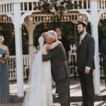 Bride hugging her father at the wedding