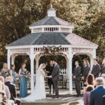 Bride and groom holding hands on display