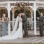 Bride and groom kissing each other