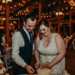 Bride and groom cutting the wedding cake