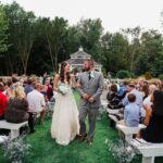 Bride and groom walking holding their hands