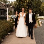 Bride and groom smiling and walking