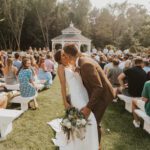 Bride and groom kissing at the wedding