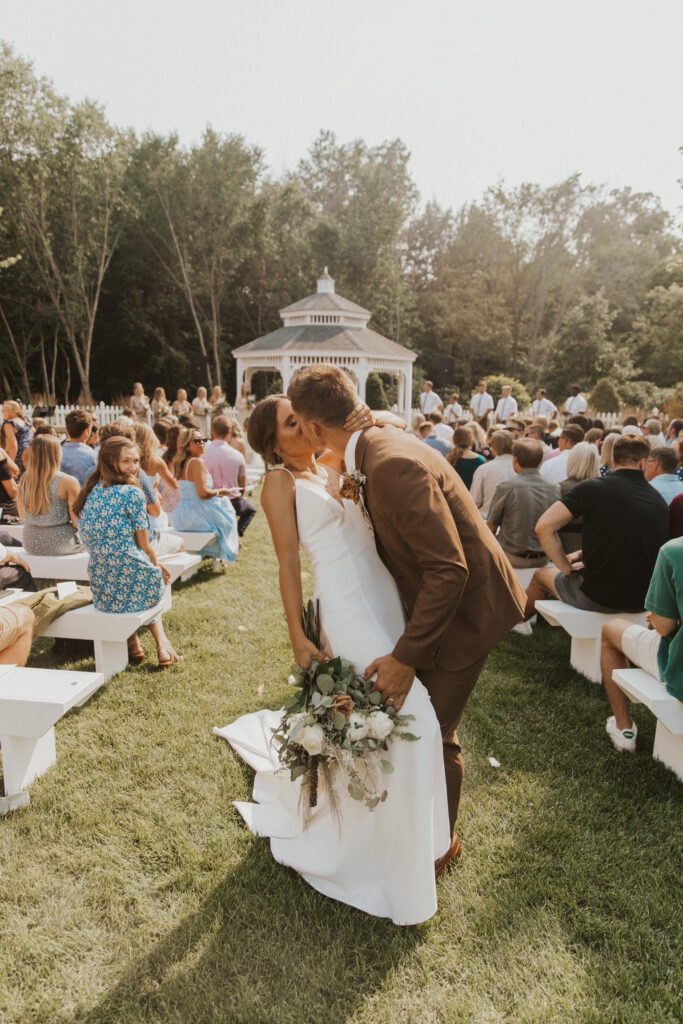 Bride and groom kissing at the wedding