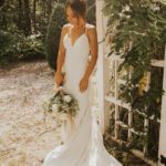 Bride holding bouquet and posing