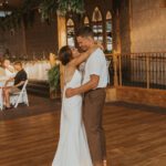 Bride and groom holding each other